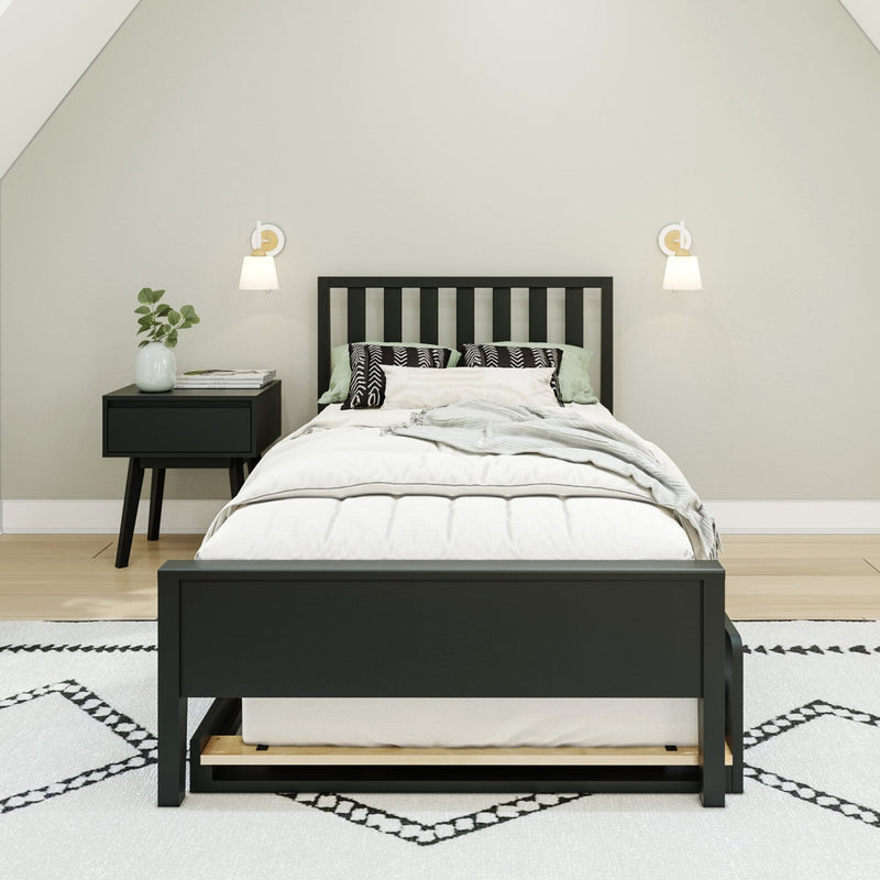 Modern black bed frame with white bedding in a minimalist bedroom setting.