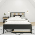 Modern minimalist bedroom with black-frame wood-slat bed, white bedding and patterned pillows, nightstand with books and vase, wall sconces and neutral decor