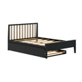 Black wooden platform bed frame with vertical slatted headboard, exposed wooden slats and under-bed pull-out storage drawer