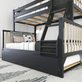 Black modern bunk bed with integrated ladder, pull-out trundle drawer, wood slats and neutral bedding in a minimalist kids' bedroom
