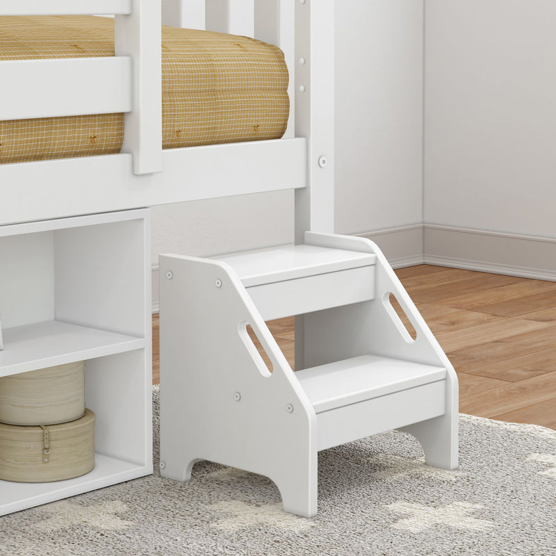 White wooden toddler step stool with handles next to a bed, perfect for children's bedroom.