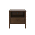 Dark walnut nightstand with carved spindle legs, single drawer, open shelf and integrated power outlet with USB ports