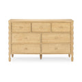 Light natural wood seven-drawer dresser with turned spindle side columns, round wooden knobs and tapered legs — modern farmhouse bedroom storage