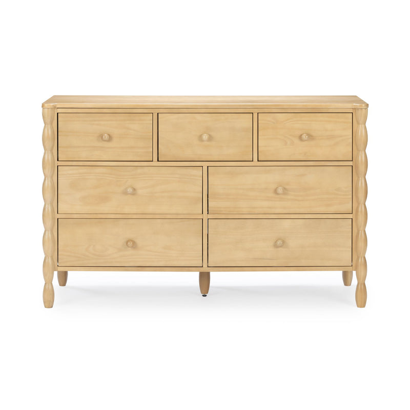 Light natural wood seven-drawer dresser with turned spindle side columns, round wooden knobs and tapered legs — modern farmhouse bedroom storage