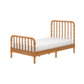 Twin solid wood spindle bed frame with white mattress in honey oak finish, turned legs and vintage cottage style