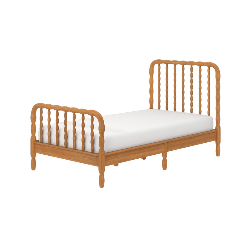 Twin solid wood spindle bed frame with white mattress in honey oak finish, turned legs and vintage cottage style