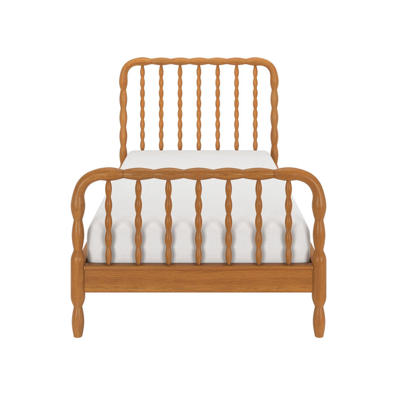 Front view of a light oak wooden spindle bed frame with matching spindle headboard and footboard and a white mattress, classic farmhouse bedroom furniture