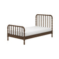 Dark brown wooden spindle headboard and footboard bed frame with white mattress, traditional farmhouse-style bedroom furniture on white background