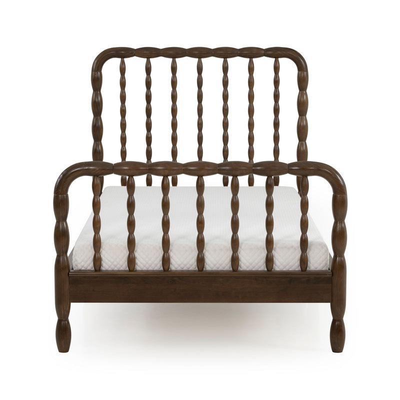 Dark walnut solid wood spindle bed frame with turned spindles on headboard and footboard and a white mattress on a clean white background