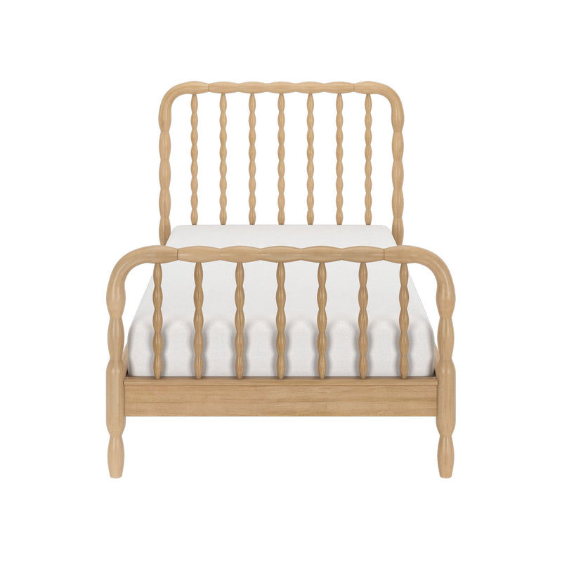 Front view of a light natural wood spindle twin bed frame with turned spindles, headboard and footboard, white mattress, modern farmhouse style
