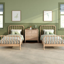 Cozy kids twin bedroom with sage green walls, natural wood spindle beds, striped bedding, wooden dresser and plush toys