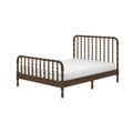 Walnut wooden spindle bed frame with turned spindles and white mattress on a low platform, modern farmhouse bedroom furniture