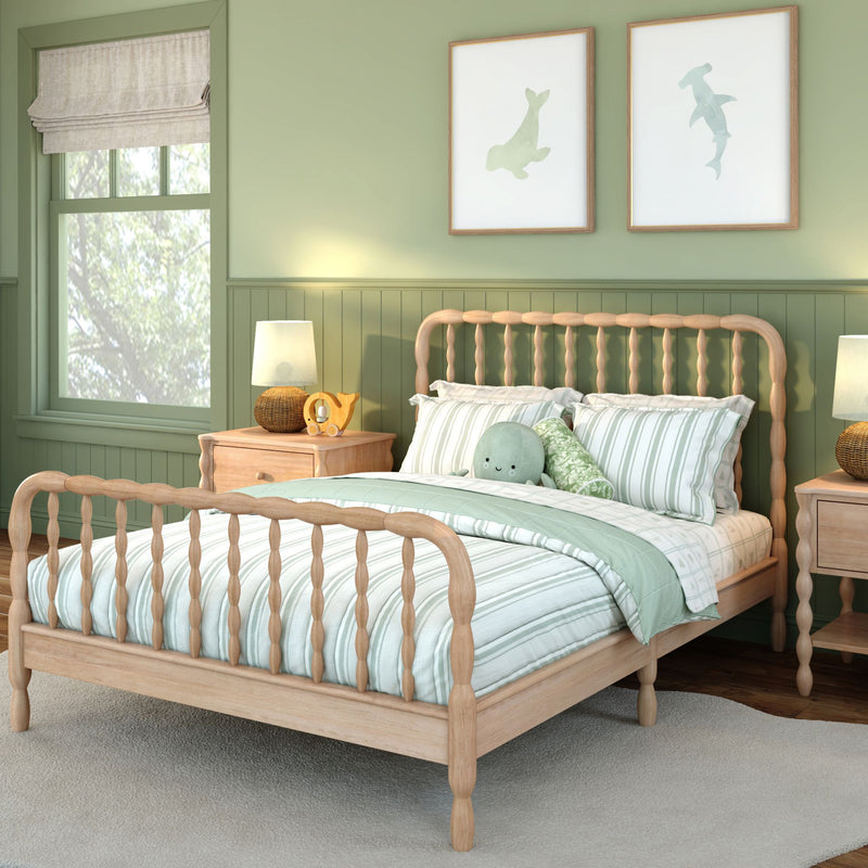 Cozy mint-green children's bedroom with light wood spindle bed, striped mint-and-white bedding, plush sea creature pillow, matching wooden nightstands with lamps and framed ocean prints
