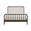 Dark brown wooden spindle bed frame with turned spindle headboard and footboard and white mattress, farmhouse-style bedroom furniture