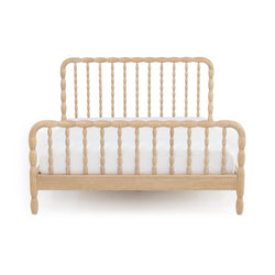 Natural wood spindle bed frame with turned bead spindles and curved headboard in light oak finish