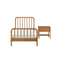 Natural oak spindle bed frame with white bedding and matching wooden nightstand, classic farmhouse bedroom furniture on white background