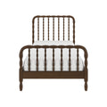 Dark wooden spindle bed frame with turned spindles, vintage farmhouse headboard and footboard paired with white mattress