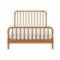 Wooden spindle bed frame with turned spindle headboard and footboard in natural oak finish, white mattress, classic farmhouse bedroom furniture