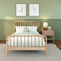 Mint green nursery bedroom with wooden spindle bed, striped mint bedding, green paneled wall, coastal sea-animal wall art and wicker bedside lamp