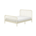 Ivory spindle wooden bed frame with turned posts and white mattress, vintage farmhouse-style headboard and footboard