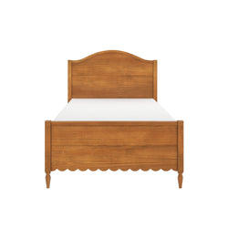 Solid wood twin bed frame with arched headboard and scalloped footboard in honey oak finish, white mattress