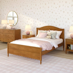 Cozy pink children's bedroom interior with wooden single bed, floral wallpaper, pink bedding and throw, plush teddy bear, matching nightstands, dresser and soft area rug