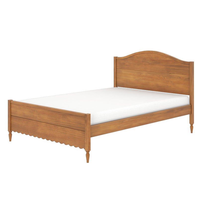 Natural oak wooden platform bed frame with curved headboard, scalloped footboard and turned legs, white mattress, farmhouse bedroom style
