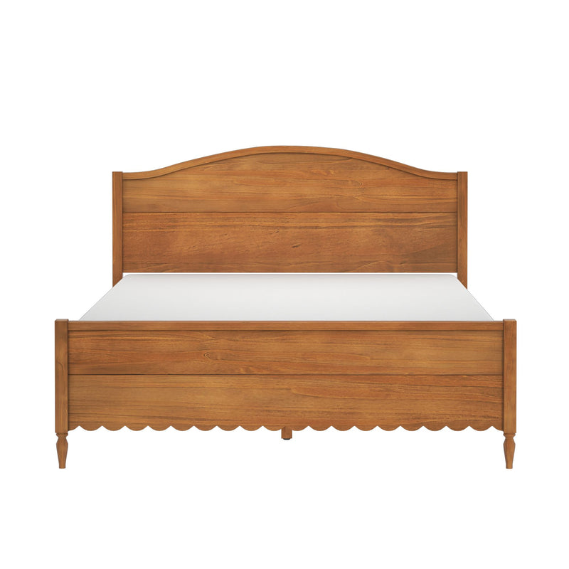 Solid wood panel bed frame with curved headboard, scalloped apron, turned tapered legs and warm honey wood finish — rustic farmhouse bedroom centerpiece