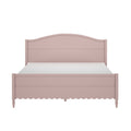 Pink wooden bed frame with arched headboard, scalloped footboard and turned legs on white background — feminine shabby chic bedroom furniture