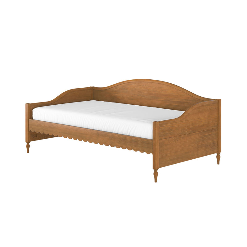 Solid wood twin daybed with carved arched headboard, scalloped apron and turned legs in natural oak finish with white mattress