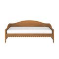 Wooden daybed frame with curved headboard and white mattress, rustic bedroom furniture isolated on white background