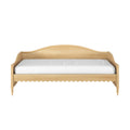 Light natural wood daybed with curved headboard, scalloped apron and turned legs, white mattress, farmhouse/Scandinavian style