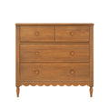 Honey oak 4-drawer wooden dresser with two small top drawers, two large bottom drawers, turned legs and scalloped apron — rustic farmhouse bedroom storage chest