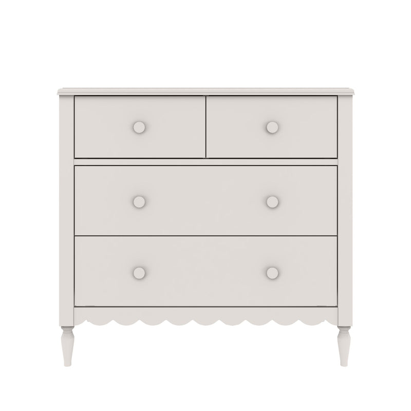 White wooden dresser with two small top drawers and two large lower drawers, scalloped apron and turned legs, farmhouse-style nursery chest