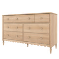 Six-drawer natural wood dresser with round wooden knobs, turned legs and scalloped apron, bedroom storage chest