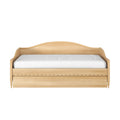 Light oak wooden twin daybed with curved headboard, scalloped storage drawer front and white mattress
