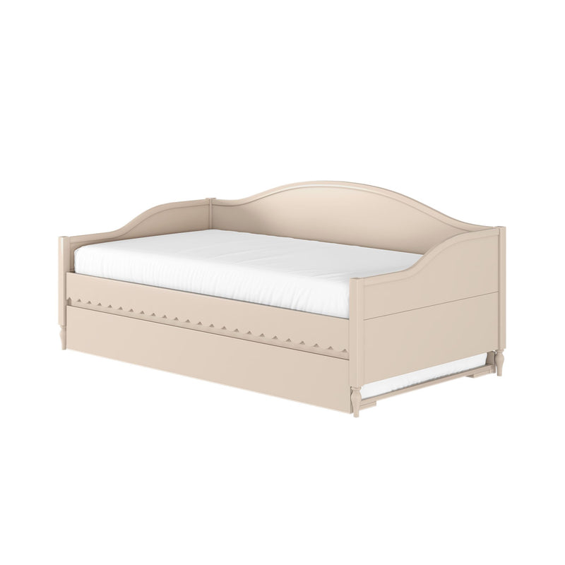 Beige wooden daybed with curved headboard, scalloped apron and pull-out trundle drawer, white mattress — farmhouse-style storage bed