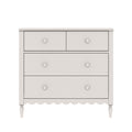 White wooden dresser chest of drawers with two small top drawers and two large lower drawers, round knobs, turned legs, scalloped apron, farmhouse style