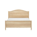 Light oak wooden bed frame with arched headboard, scalloped skirt and turned legs — farmhouse-style bedroom furniture with mattress