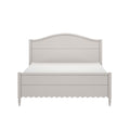 Light gray wooden bed frame with curved headboard, scalloped footboard skirt and turned legs, modern farmhouse bedroom furniture