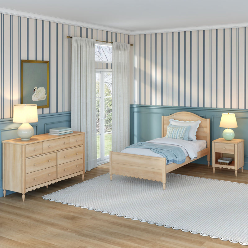 Cozy coastal-style twin bedroom with light wood bed and dresser, teal wainscoting, vertical blue-striped wallpaper, sheer white curtains, bedside lamps, and swan artwork
