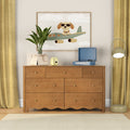 Mid-century wooden six-drawer dresser in children's room with potted plant, yellow curtains, blue record player, instant camera and framed dog airplane print
