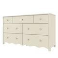 Cream painted wooden dresser with gold round knobs, scalloped bottom trim and multiple drawers for bedroom storage in modern farmhouse style