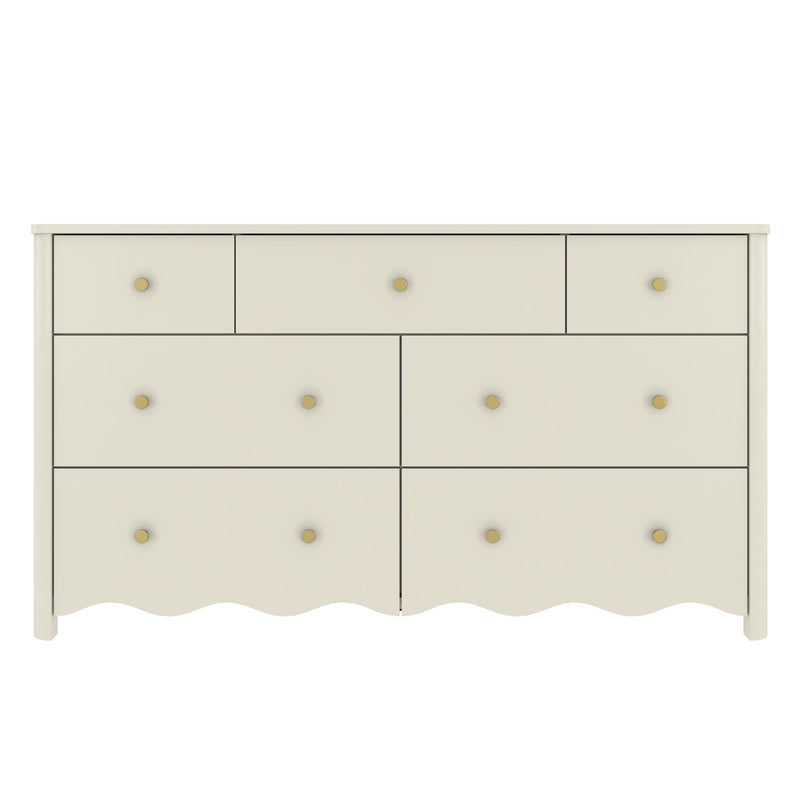 White wooden 7-drawer dresser with scalloped bottom edge and brass knobs, nursery or kids' bedroom storage dresser in modern farmhouse style