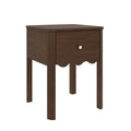Dark walnut wooden nightstand with single drawer, scalloped apron and round brass knob on slim legs