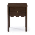 Dark walnut wooden nightstand with single drawer and brass knob, scalloped apron and rounded legs on white background
