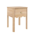 Light wood bedside table with single drawer and round brass knob, scalloped apron and four legs — modern farmhouse bedroom nightstand