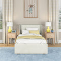 Children's bedroom with upholstered twin bed, white and yellow bedding, wooden nightstands with yellow lamps, blue area rug, plaid curtains and framed mouse wall art