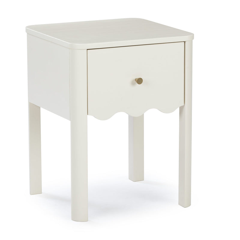 Cream white wooden bedside table nightstand with single drawer, scalloped apron and round brass knob on tall slender legs, modern farmhouse style