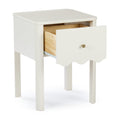 White wooden nightstand bedside table with single open drawer showing natural wood interior, brass knob and scalloped apron